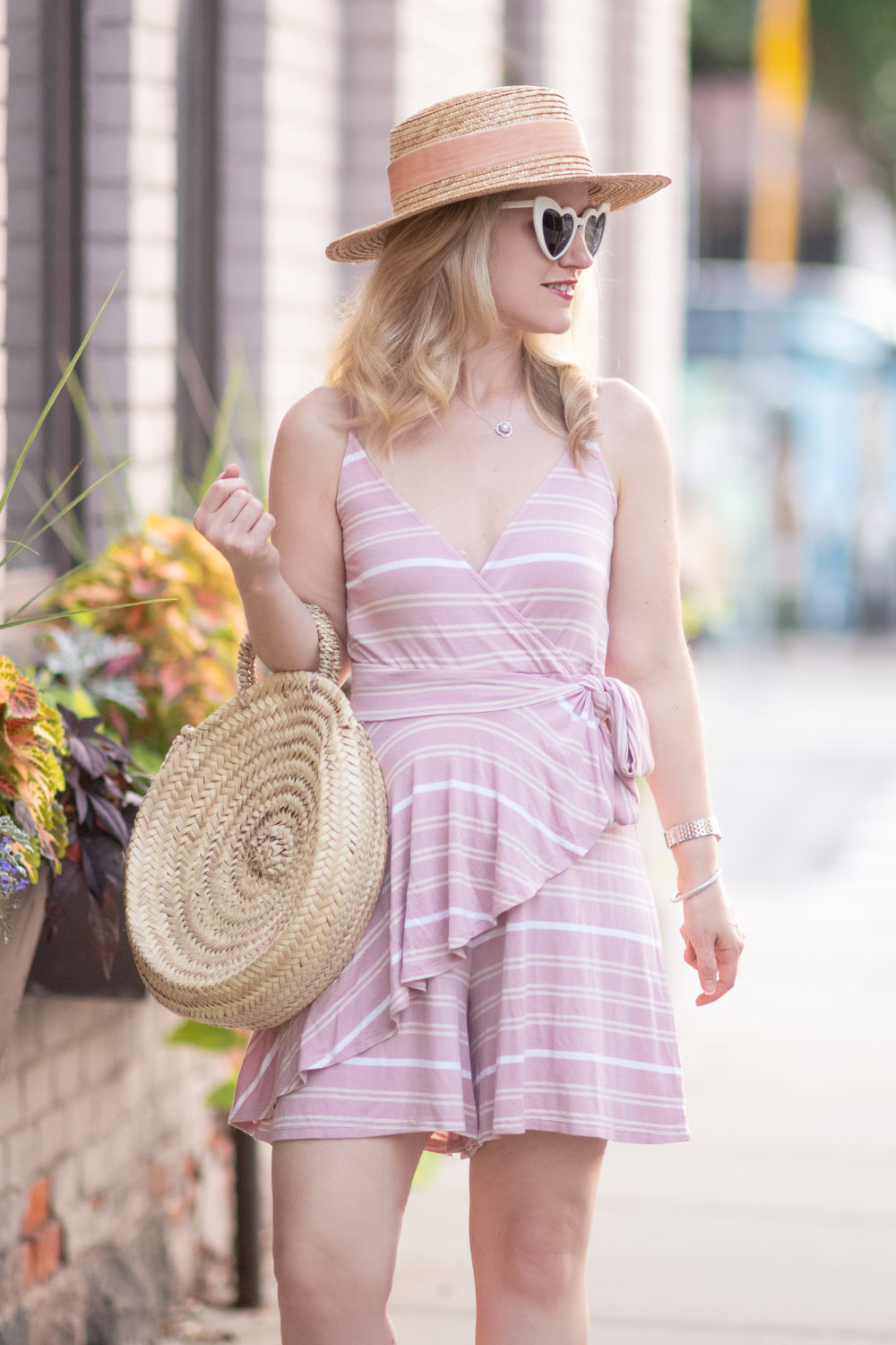 Michigan Petite Fashion and Lifestyle Blog | BP Wrap Romper | Saint Laurent Loulou heart-shaped acetate sunglasses | Caterina Bertini Straw Circle Tote